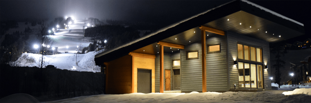 Energy Step Code How it Works Header - photo of residential building exterior at night